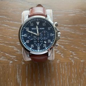 Michael Kors mens watch. Blue face and brown leather strap.